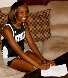 Destinee Showell signs scholarship award